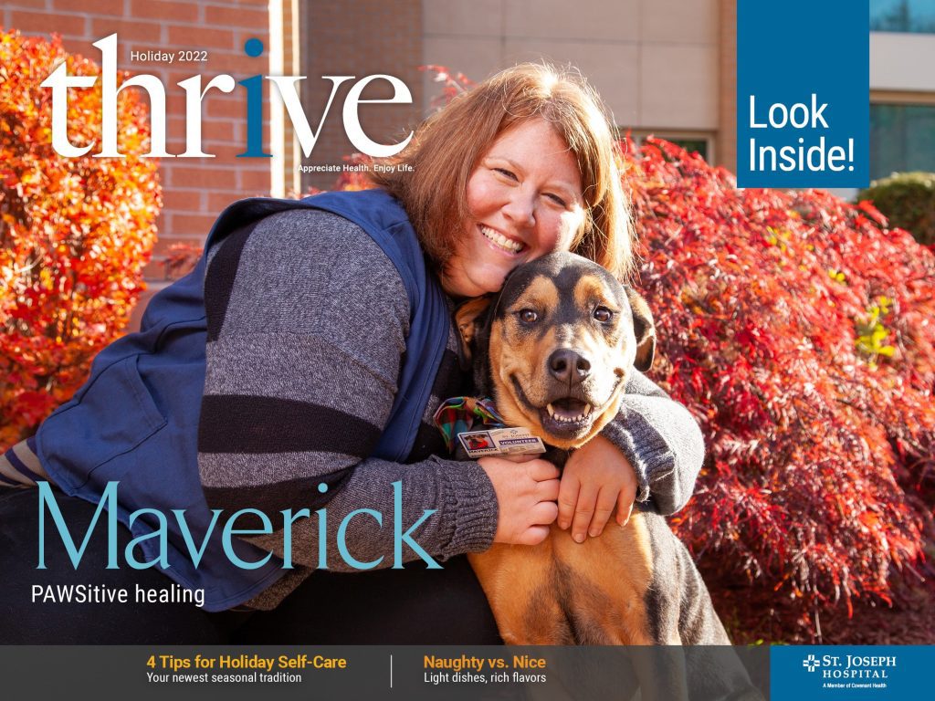 Thrive holiday magazine cover with a therapy dog and his handler.